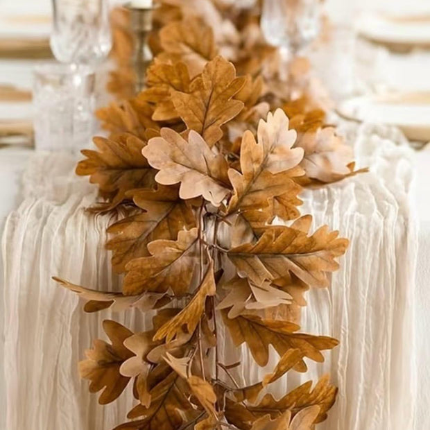 Brown Autumn Leaf Garland, brown and ochre leaves trailing down a dining table