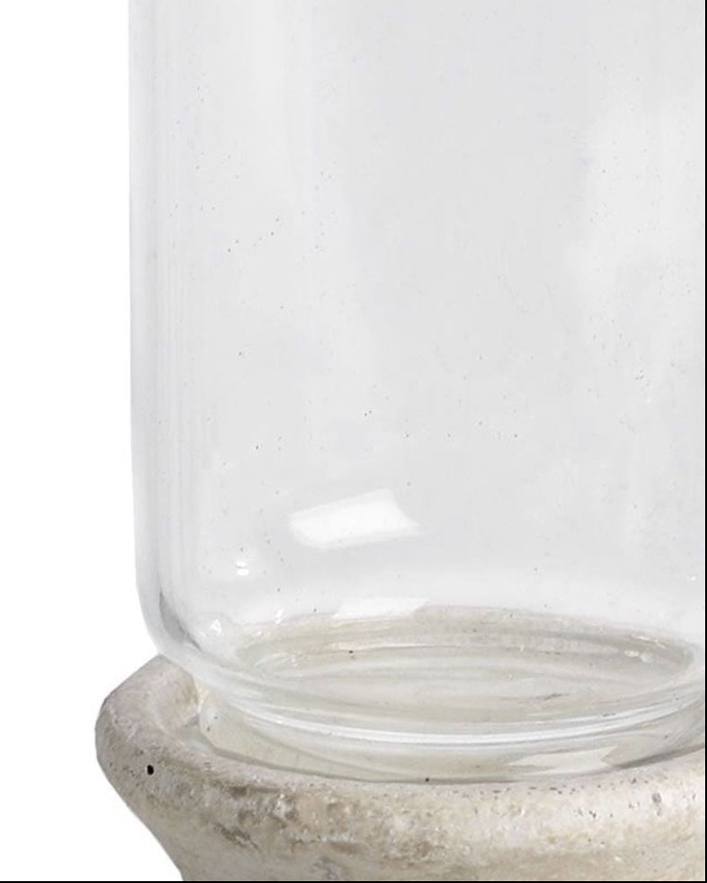 Stone-based hurricane candle lantern for home decor, featuring a glass enclosure and rustic stone base by Hill Interiors.