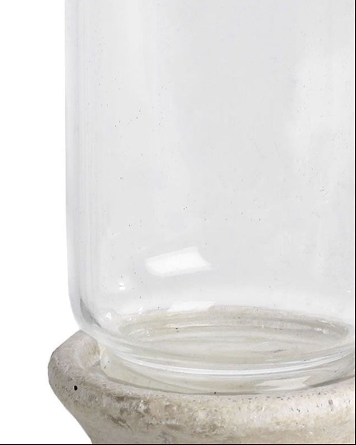 Stone-based hurricane candle lantern for home decor, featuring a glass enclosure and rustic stone base by Hill Interiors.