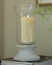 Stone-based hurricane candle lantern for home decor, featuring a rustic design with glass sides and a sturdy stone base.