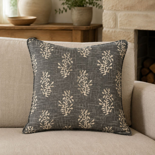 Grey Block Printed Reversible Flower Cushion Cover, grey cushion with cream botanical sprigs on an armchair