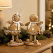 Standing Gingerbread Ornament, two brown gingerbread figures on a wooden console