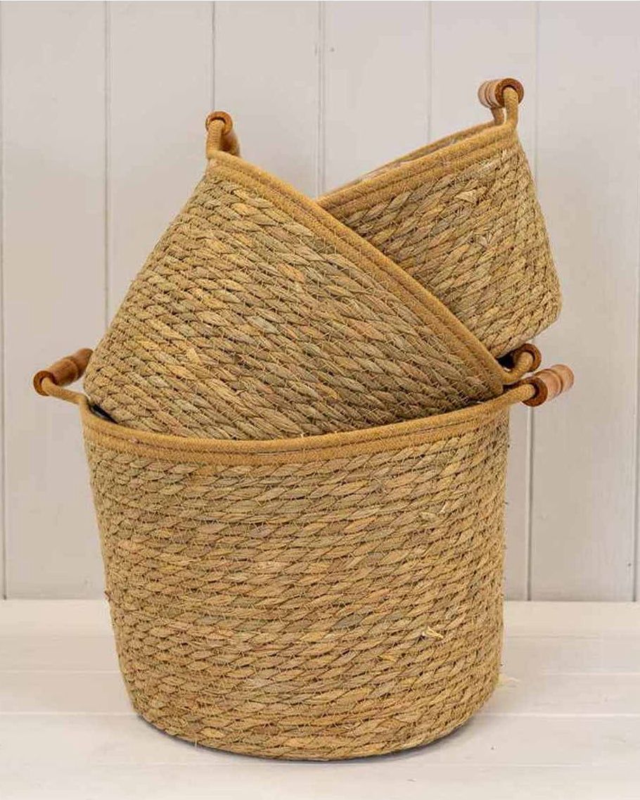 Natural woven rope basket with handles, ideal for home decor storage, by Satchville.