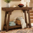 Rustic Natural Medium Gallery Wood Effect Console Table, angled view of the rustic console with books and a throw
