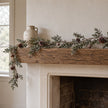Pinecone garland draped over a fireplace