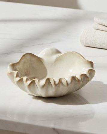 Beige ceramic shell bowl for home décor, featuring a detailed shell design, by Heaven Sends.