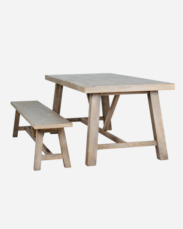 Large wooden dining bench from Hill Interiors Haldon Collection, showcasing sturdy construction and a polished finish.