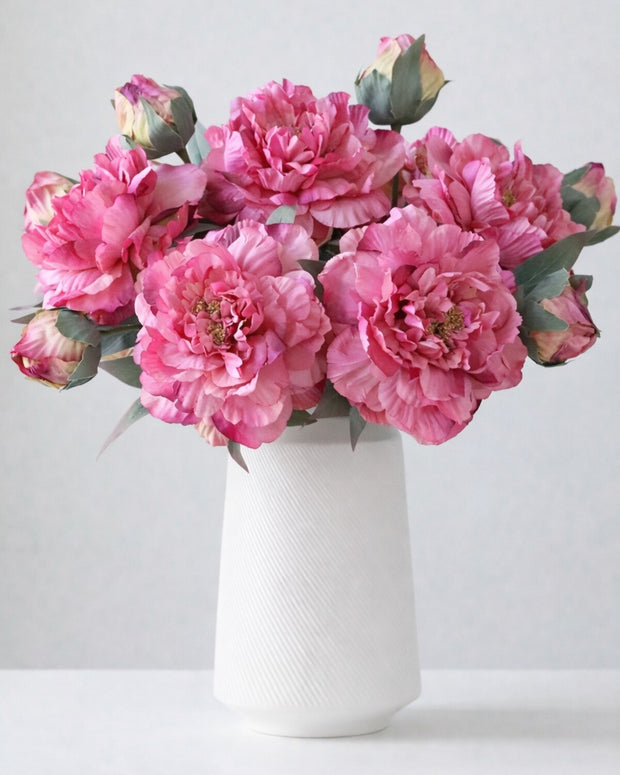 Artificial fuchsia pink open double peony flower stem from Starlight Express, featuring vibrant blooms and realistic green foliage.