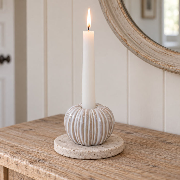Ceramic Natural Pumpkin Dinner Candle Holder, striped ceramic pumpkin holder with a lit taper on a table