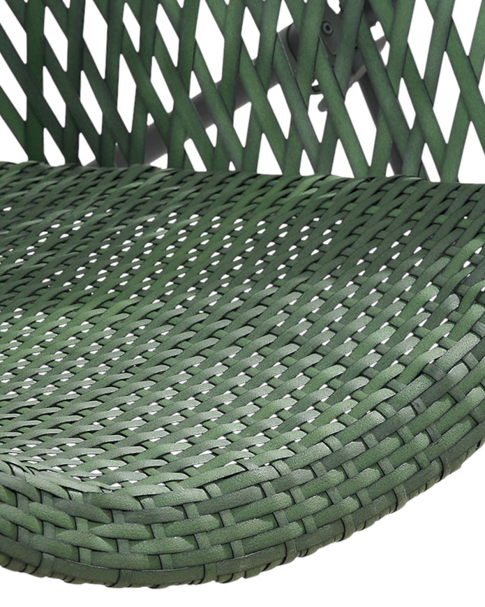 Green rattan garden furniture set with a chair and table by Pacific Lifestyle Ltd, perfect for outdoor relaxation.