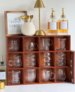 Dark wooden mug display shelf unit from Starlight Express, ideal for kitchen and dining room organization.