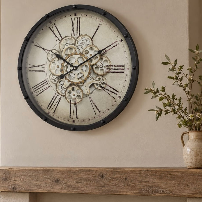 Black Frame Mechanical Skeleton Clock by Heaven Sends showing exposed gears and intricate design on a sleek black frame.