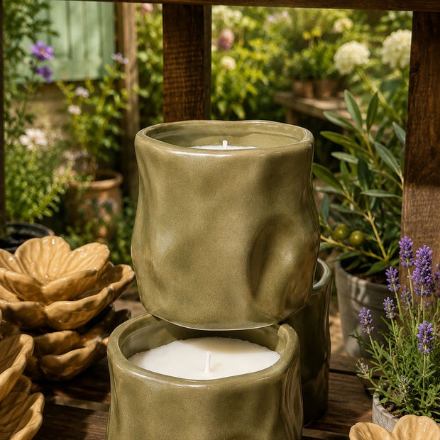 Olive Green Sculpted Candle, two olive green sculptural candle jars displayed outdoors