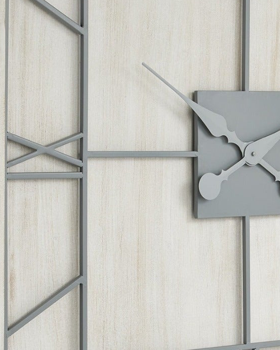 White large square wooden Williston wall clock by Hill Interiors showing a minimalist design with black clock hands on a white face.