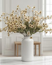 Cream artificial daisy flower stem from Starlight Express, showcasing realistic petals and green foliage for decorative arrangements.