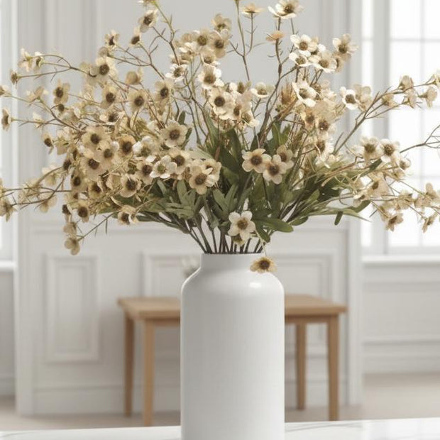 Cream artificial daisy flower stem from Starlight Express, showcasing realistic petals and green foliage for decorative arrangements.