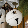Large Hanging White Bells Garland With Silver Bow, close-up of the white bells, star cutouts and silver bow