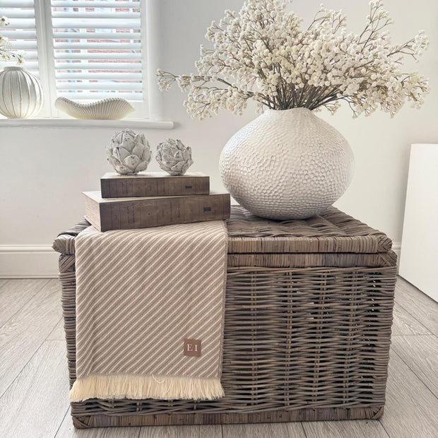 Zaffera Ivory Caldron Textured Vase, large ivory vase with white stems above a woven trunk