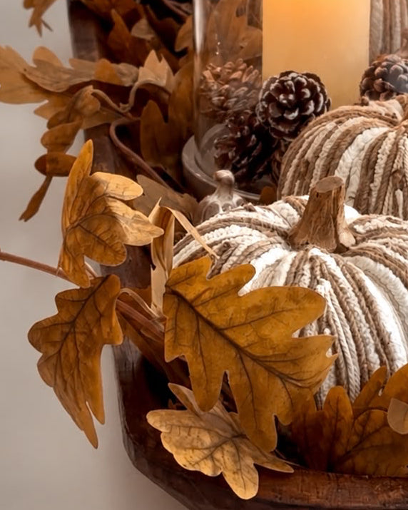 Brown autumn leaf garland from Starlight Express with realistic fall-colored leaves for seasonal decoration.