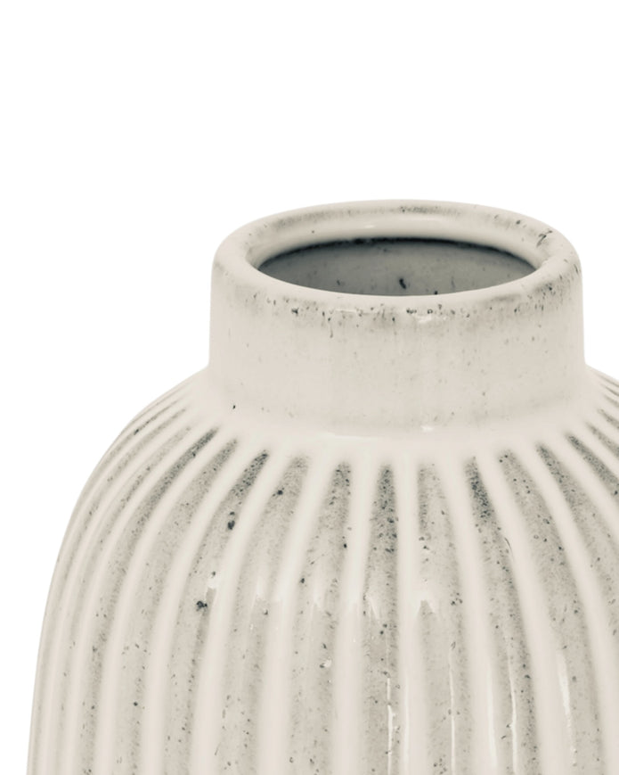 Hill Interiors Monte Medium Ribbed Vase, ceramic with textured ribbed design, neutral color, standing on a wooden surface.