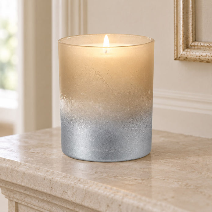 Faded Bronze Glass Tealight Holder, glowing bronze and silver glass holder beside a mirror