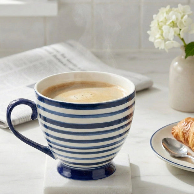 Blue and white striped ceramic mug from Candlelight Products Ltd for kitchen and dining use, shown with a handle and striped pattern.