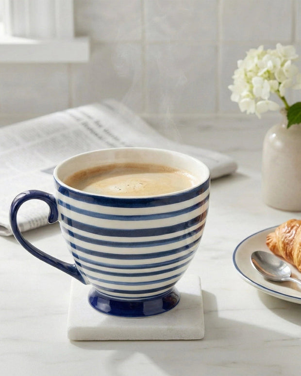 Blue and white striped ceramic mug from Candlelight Products Ltd for kitchen and dining use, shown with a handle and striped pattern.