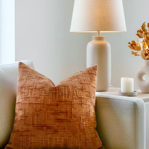 Orange Chenille Cushion Cover, orange chenille cushion on an armchair beneath a lamp