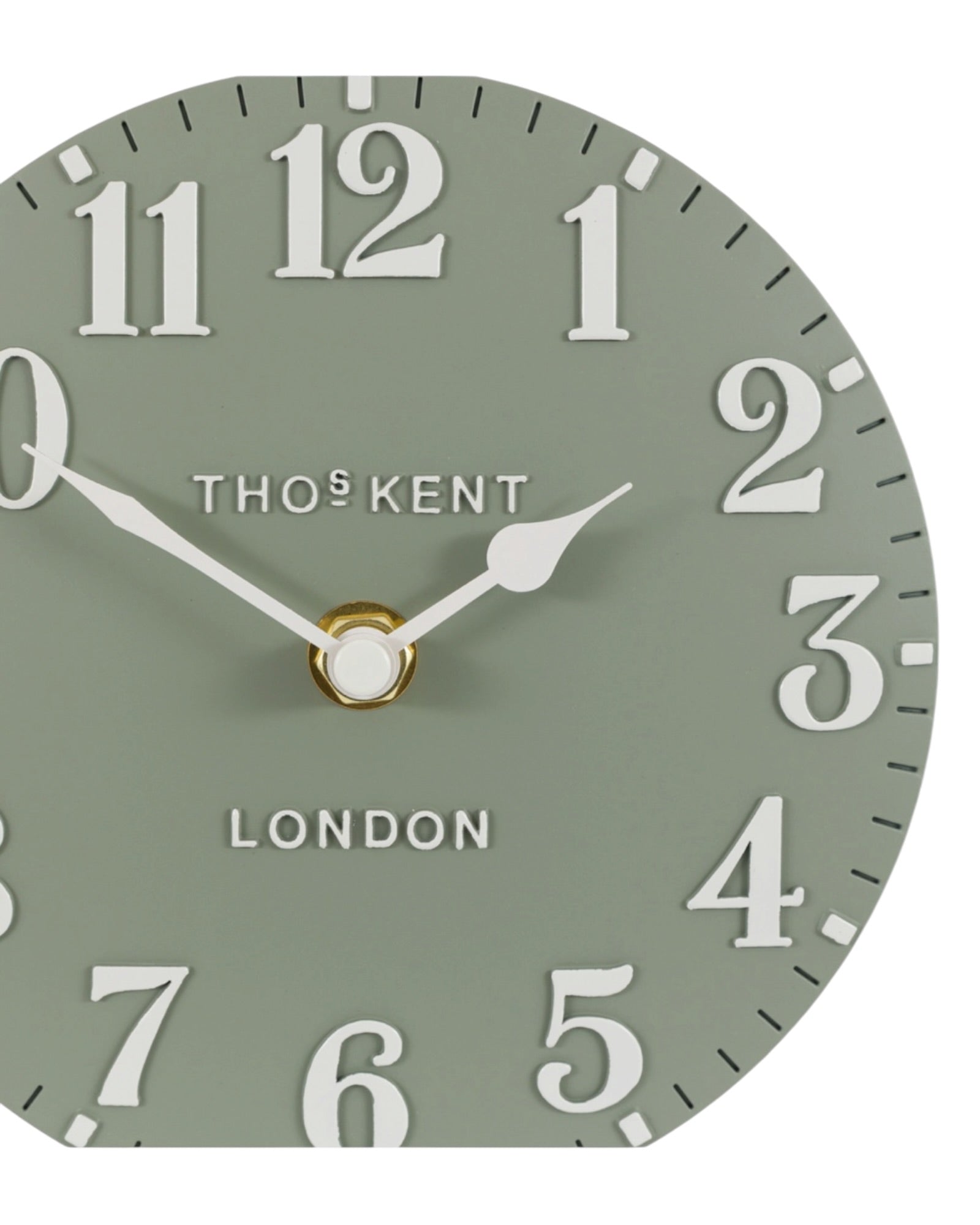 Thomas Kent 6-inch Arabic mantle clock in seagrass green with black numerals and classic round design.