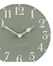 Thomas Kent 6-inch Arabic mantle clock in seagrass green with black numerals and classic round design.