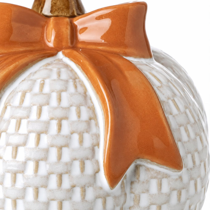 White ceramic pumpkin with orange bow, autumn décor by Heaven Sends, showcasing a festive fall-themed decorative piece.