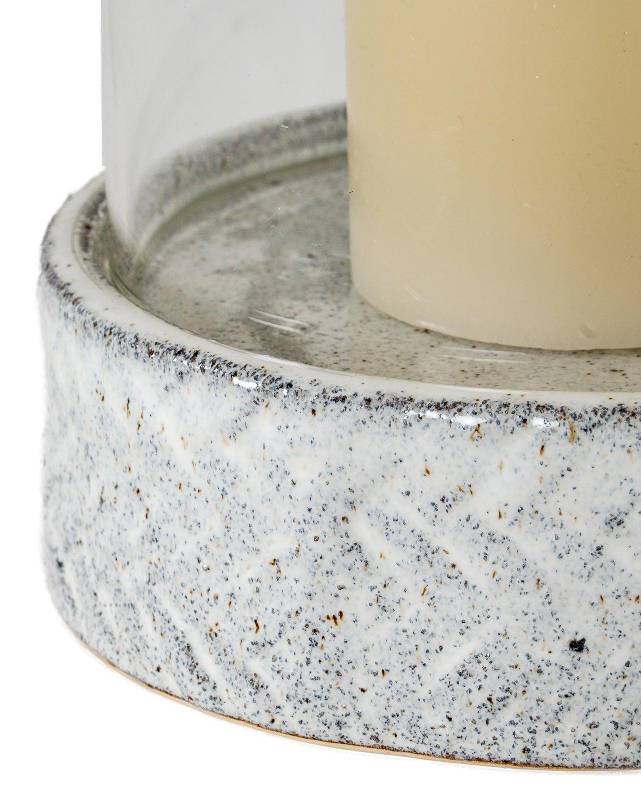 White ceramic hurricane candle lantern for home decor, with a classic design and glass insert, by Hill Interiors.