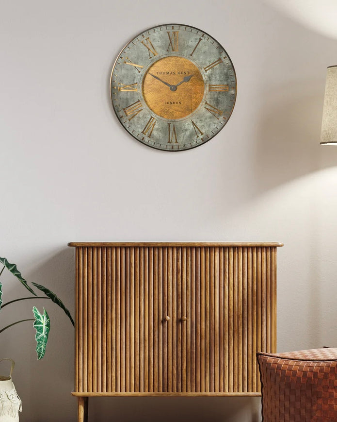 Thomas Kent Florentine Star wall clock with black frame and white dial, featuring star-shaped design elements and clear numeral markings.