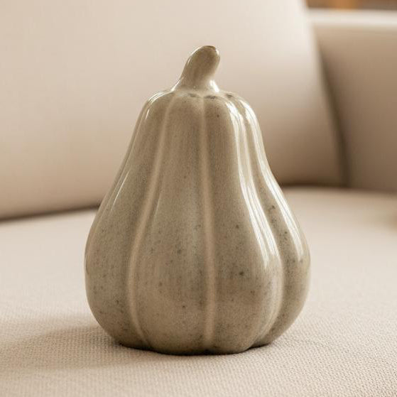 Beige Mottle Ceramic Pumpkin Decoration, close view of the tall mottled beige squash ornament