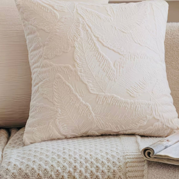 Ivory cushion cover with embossed leaf design, soft furnishings by Starlight Express, showcasing textured fabric and elegant decor.