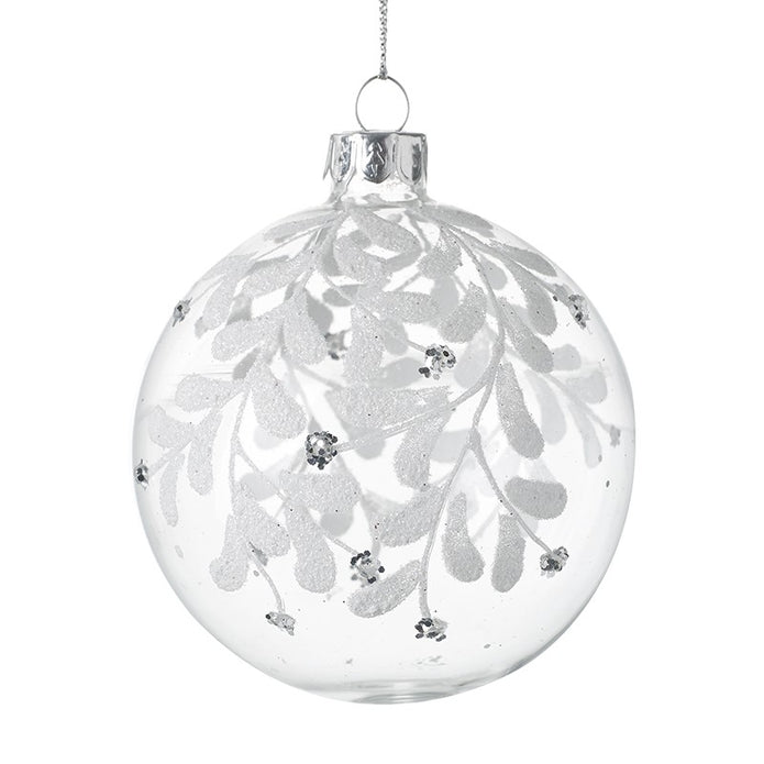 Clear Glass Bauble With White Leaves, clear round bauble with white leaves and a silver cap on white
