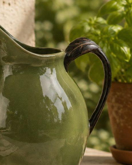 Olive Green Jug Reactive Glaze, close-up of the green jug's dark handle and glossy glaze