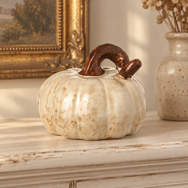 Cream And Brown Ceramic Pumpkin, cream and brown ceramic pumpkin on a mantel