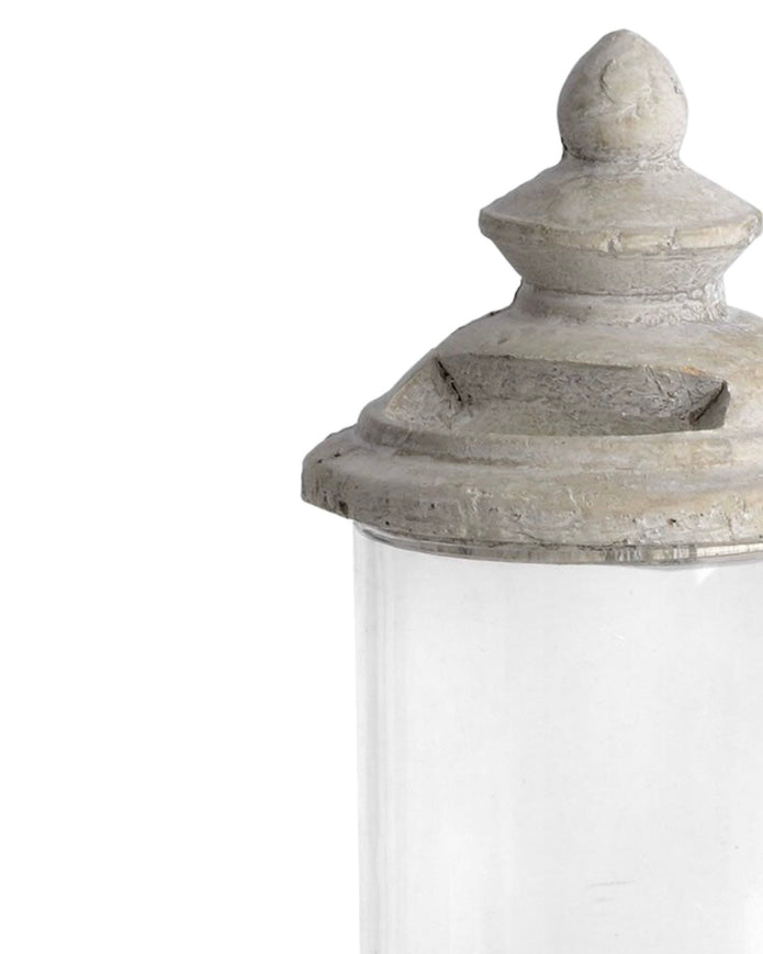 Stone lidded hurricane candle lantern for home decor, featuring a clear glass enclosure and rustic stone finish by Hill Interiors.