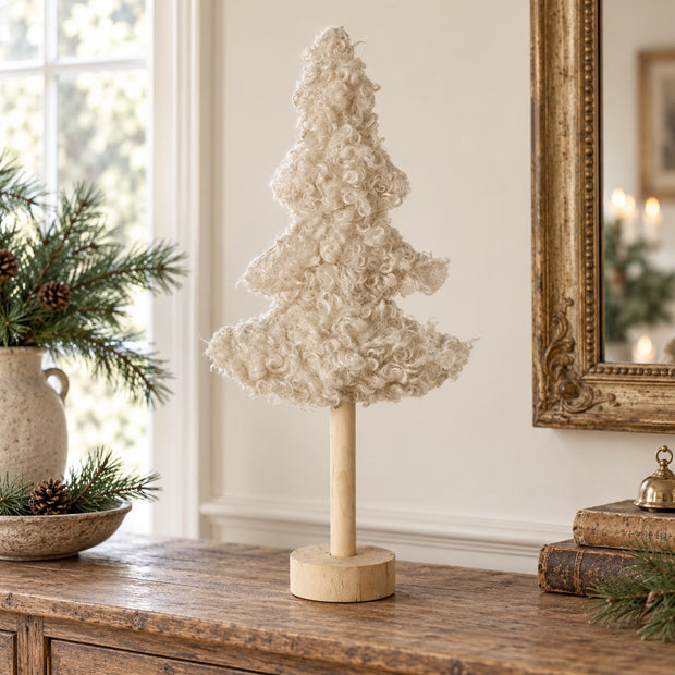 Tall Boucle Cream Tree With Wood Base, cream boucle tree beside a window and gold frame