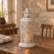 Tall white metal cut out lantern, decorative gift item with intricate design, perfect for home decor or special occasions.