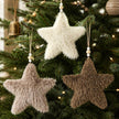 Neutral Hanging Fluffy Star, cream, taupe and brown fluffy stars hanging on a Christmas tree
