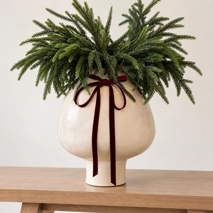 Gallery Direct Palawan neutral white stoneware footed vase with a rounded shape and textured surface.