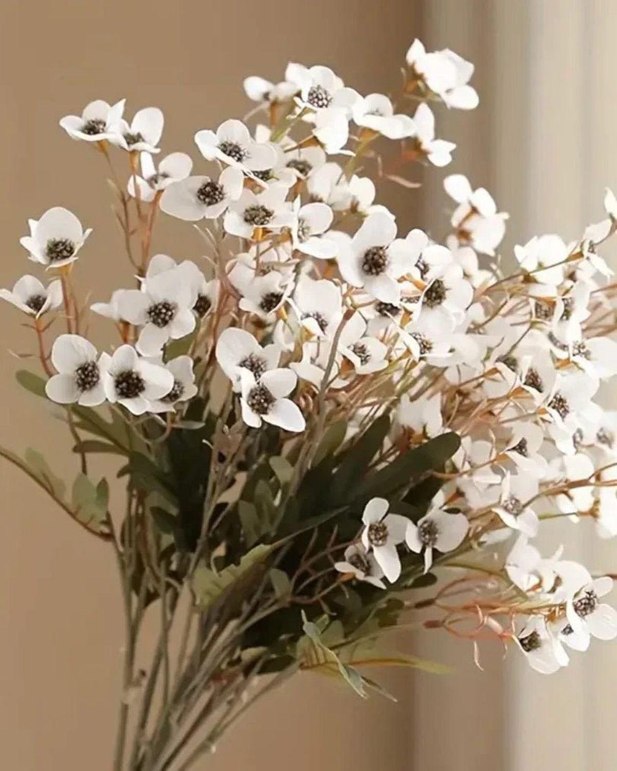 Artificial Daisy Flower Stem in white by Starlight Express, showcasing realistic white daisy blooms on a green stem.