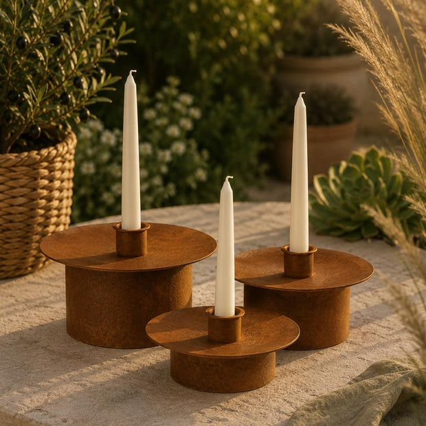 Rusty metal dinner candlestick holder from Wikholmform, large vintage home decor piece with a rustic, industrial look.