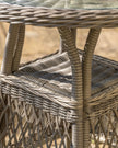 Natural rattan Menton two-seat bistro set for garden by Gallery Direct, featuring woven rattan chairs and a matching table.