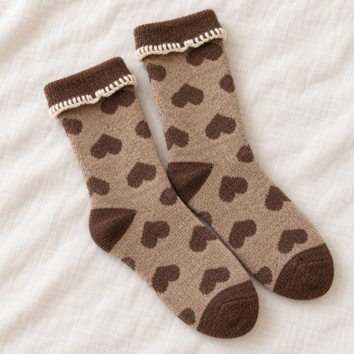 Cosy Cuff Socks - Beige Heart, beige heart-patterned socks on cream fabric