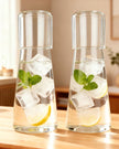 Starlight Express glass carafe jug set with two clear, elegant jugs featuring a sleek design and secure lids on a white background.