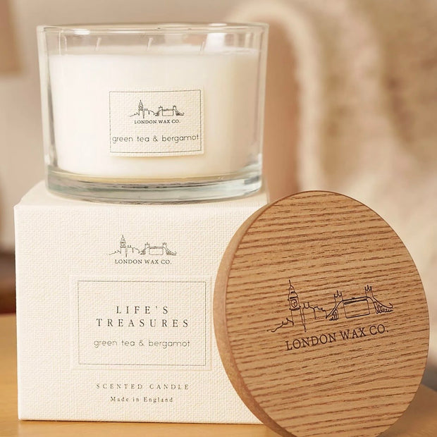 London Wax Company Triple Wick Lidded Candle - Green Tea & Bergamot, wide glass candle on its box beside an engraved wooden lid