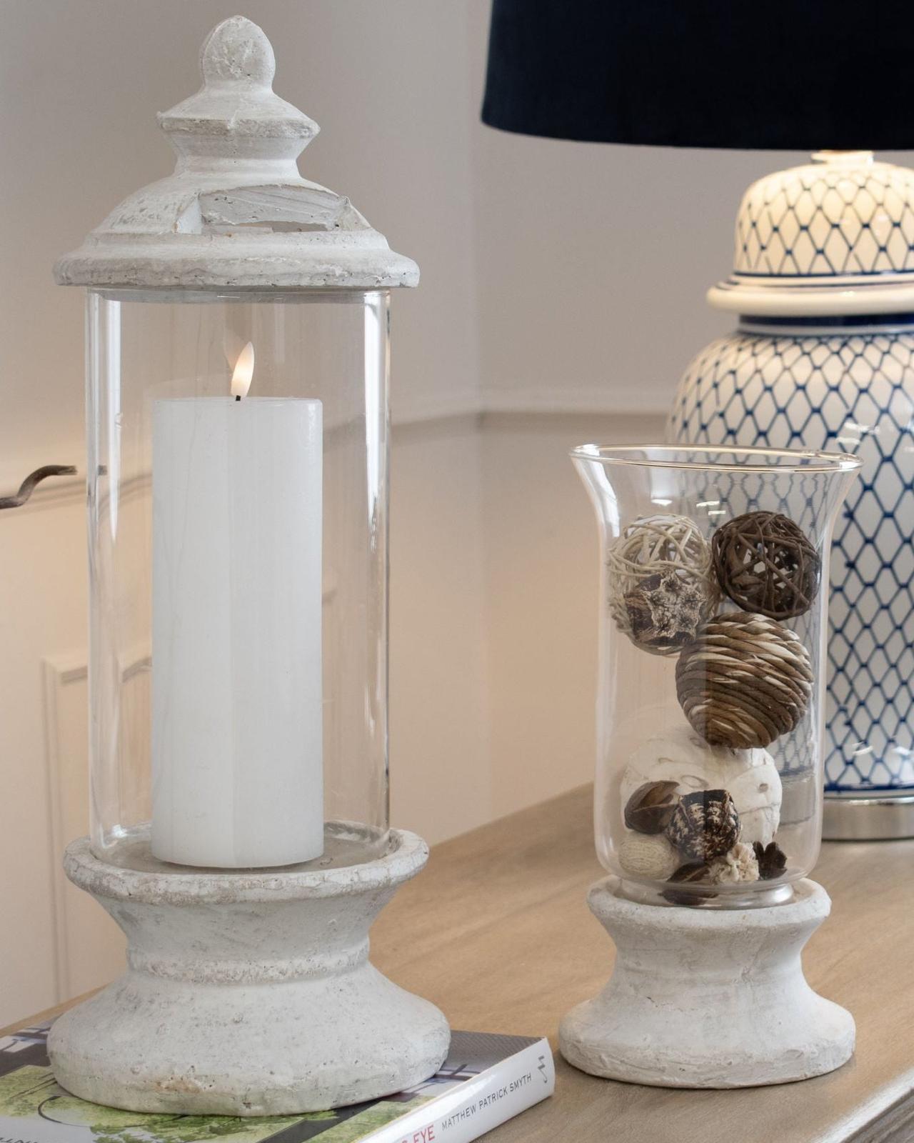 Stone-based hurricane candle lantern for home decor by Hill Interiors, featuring a rustic design with a glass enclosure.